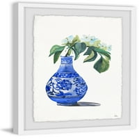 Plava vaza s bijelim orhidejem uokvirenim slikanjem ispisa